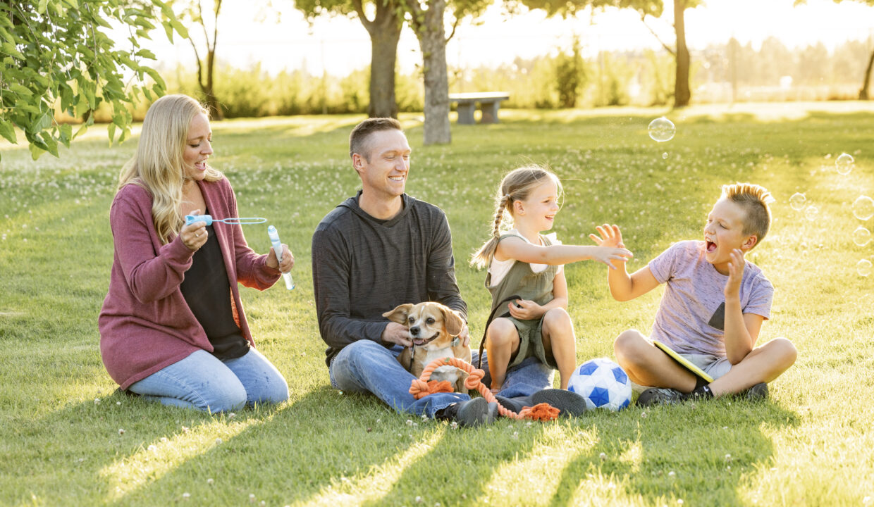 A family of four with their dog