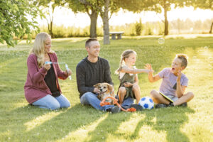 A family of four with their dog